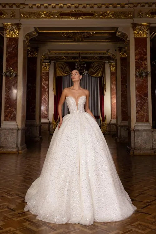 Exquisite Ball Gown Wedding Dress with Sleeveless Design, Deep Cut Neckline, and Sequined Embellishments