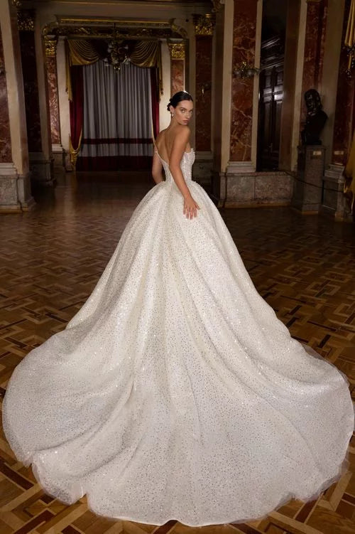 Exquisite Ball Gown Wedding Dress with Sleeveless Design, Deep Cut Neckline, and Sequined Embellishments