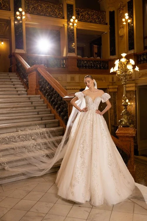 Elegant Ball Gown Wedding Dress with Cap Sleeves, Off-Shoulder Neckline, and Sequined Embellishments