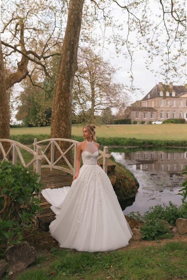 Elegant A-Line Wedding Dress with Halter Neckline, Open Shoulders, and Pearl Embellishments