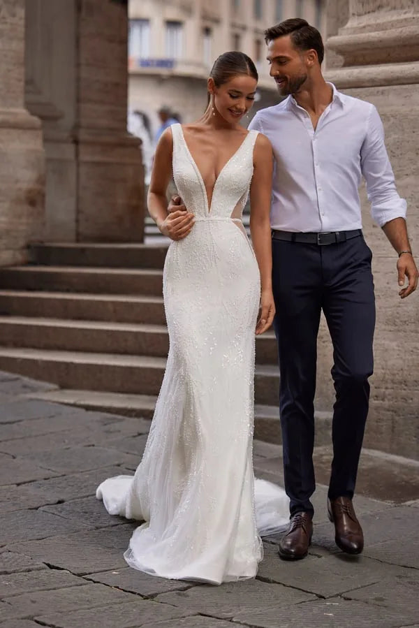 Stunning Mermaid Wedding Dress with Sleeveless Design, Deep Neckline, and Elegant Sequined Embellishments