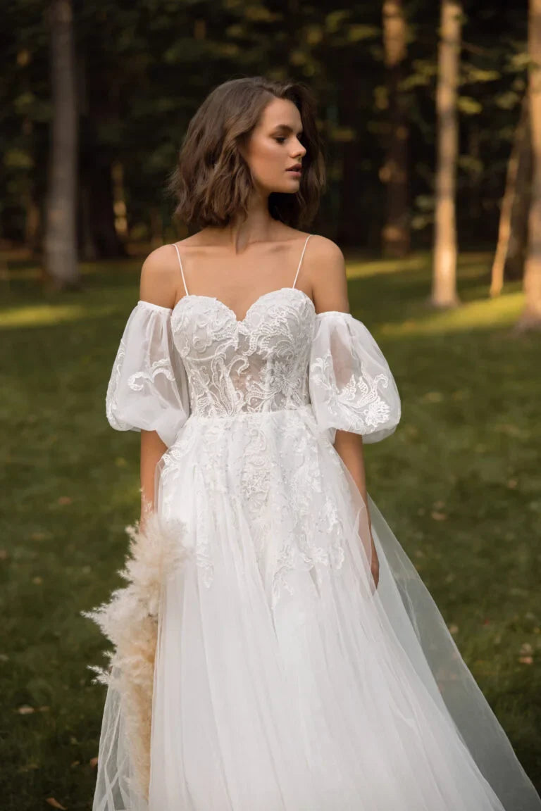 Dreamy Puffy A-Line Wedding Dress with Spaghetti Straps, Sweetheart Neckline, and Elegant Pearl Embellishments